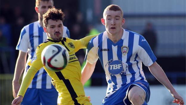 Cliftonville defender Tomas Cosgrove in action against Coleraine striker Rodney Brown at Ballycastle Road