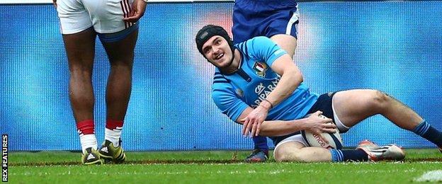 Carlo Canna scores a try for Italy in their narrow defeat by France