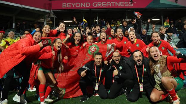 Morocco players and staff celebrate qualifying for the last 16 of the Women's World Cup