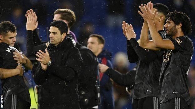 Arsenal squad and Mikel Arteta after win at Brighton