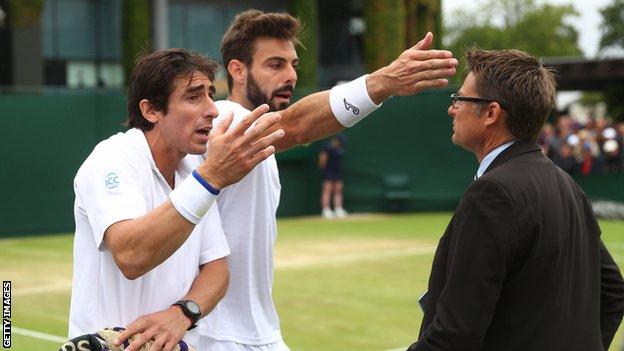 Pablo Cuevas (left) and Marcel Granollers argue with the match referee