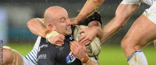 Ospreys scrum-half Brendan Leonard is tackled