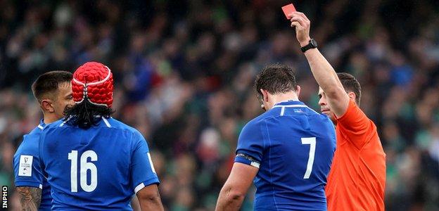 Italy's Hame Faiva is shown a red card