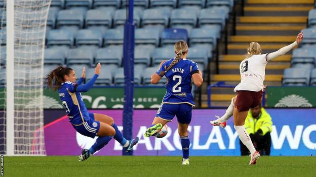 Chloe Kelly of Manchester City scores the team's first goal during the Barclays Women's Super League match between Leicester City and Manchester City