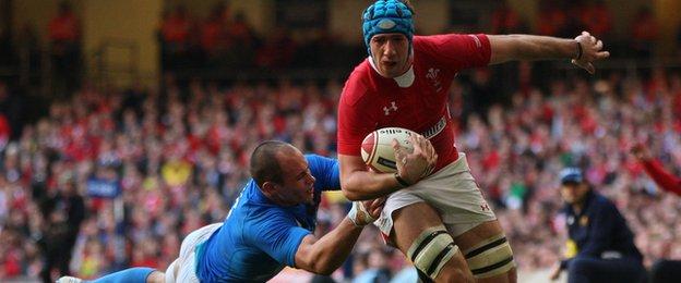 Sergio Parisse tackles Justin Tipuric in the match between Wales and Italy in Cardiff in 2012