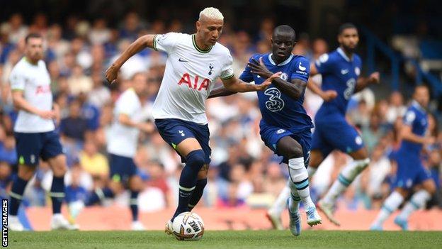 Richarlison of Tottenham Hotspur is challenged by N'Golo Kante of Chelsea