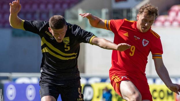 Luke Jephcott (right) in action for Wales Under-21s