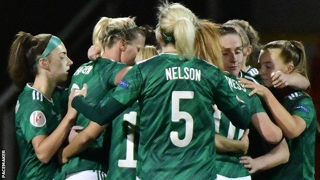 Northern Ireland players celebrate after Kirsty McGuinness put them ahead at Seaview