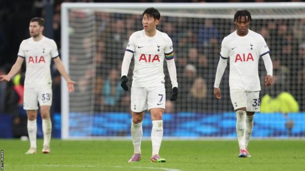 Tottenham players Ben Davies, Son Heung-min and Destiny Udogie look dejected during Tottenham's 2-1 Premier League defeat to West Ham