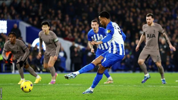 Brighton's Joao Pedro scores from the penalty spot against Tottenham in the Premier League