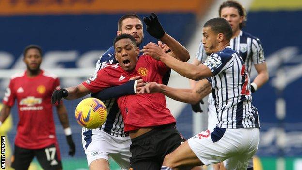 Anthony Martial challenges for the ball