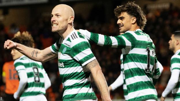 Celtic's Aaron Mooy and Jota celebrate