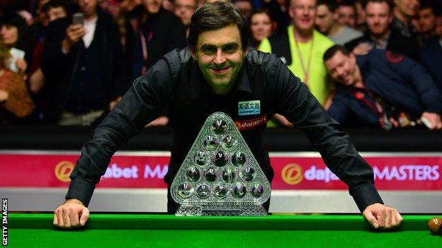 Ronnie O'Sullivan poses with the Masters trophy