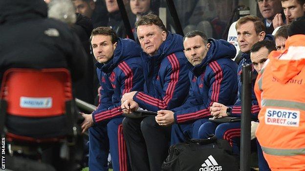 Louis van Gaal on the Manchester United bench, watching play