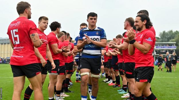 Jersey players clap off Bath's players