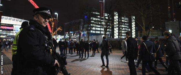 Armed Police stand guard outside of Wembley