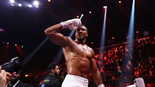 Anthony Joshua salutes the crowd