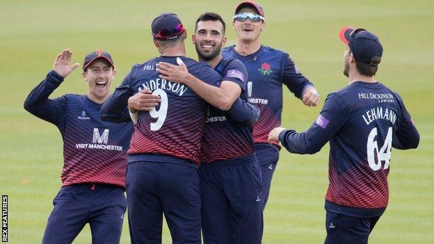 Lancashire's players celebrate Jimmy Anderson's run-out of Max Holden