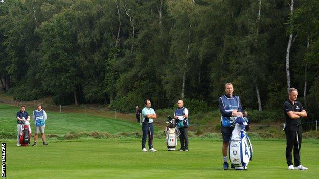 Robert MacIntyre of Scotland, Francesco Molinari of Italy and Luke Donald of England pay their respects