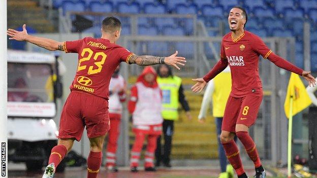 Chris Smalling celebrates with Gianluca Mancini