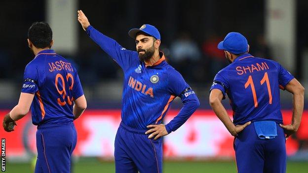India captain Virat Kohli gestures to his fielders during the ICC Men's T20 World Cup game against Namibia