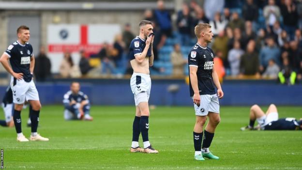 Millwall players react to their 4-3 defeat by Blackburn