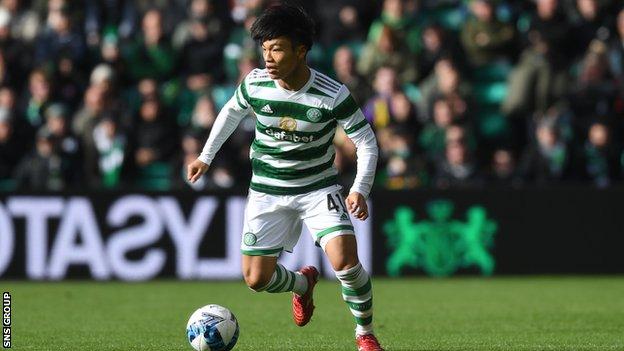 Reo Hatate dribbles the ball for Celtic