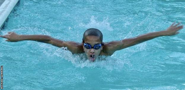 Michael Gunning swimming in competition as a child