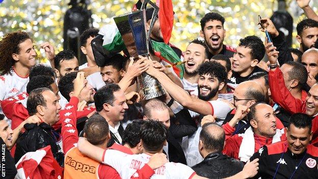Tunisia celebrate with the Kirin Cup