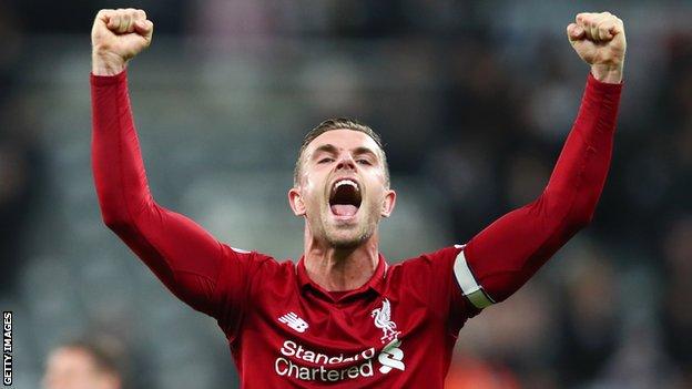 Liverpool captain Jordan Henderson celebrates after his side's victory over Newcastle