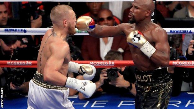 Floyd Mayweather (right) takes on Conor McGregor