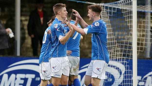 Dungannon players celebrate after Ryan Harpur scores the second of their goals in a 3-1 win over Portadown
