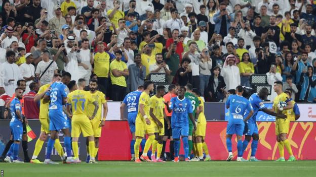 Al-Nassr and Al-Hilal players in a melee following Cristiano Ronaldo's clash with Ali Al Bulayhi