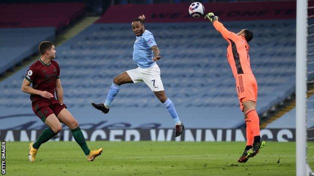 Rui Patricio makes a save from Raheem Sterling