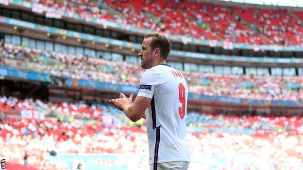 Harry Kane claps to the crowd at Wembley