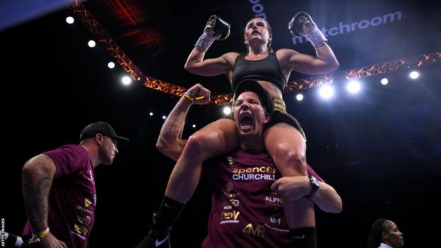 Nigel Travis holds Chantelle Cameron on his shoulders
