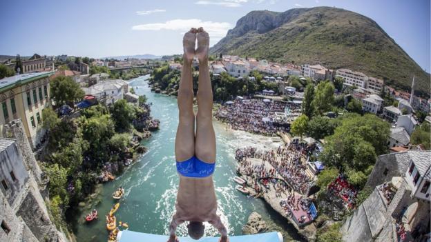 Michal Navratil prepares to dive from the the Stari Most bridge during the Red Bull Cliff Diving World Series