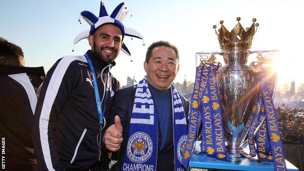Riyad Mahrez (left) with the late Leicester City owner Vichai Srivaddhanaprabha and the Premier League trophy
