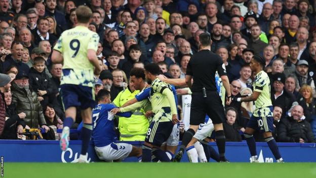 Everton and Leeds players fight during their Premier League match