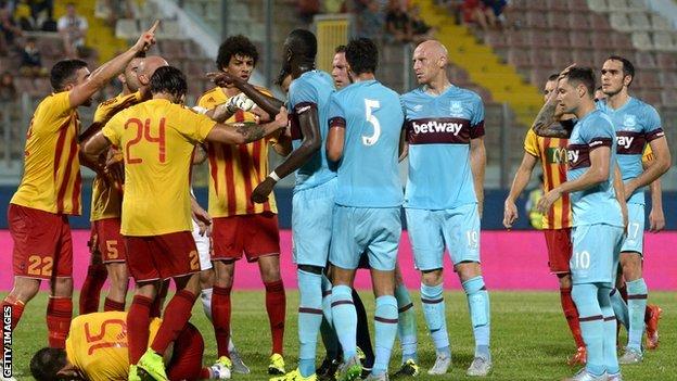 Birkirkara and West Ham players tussle during the match