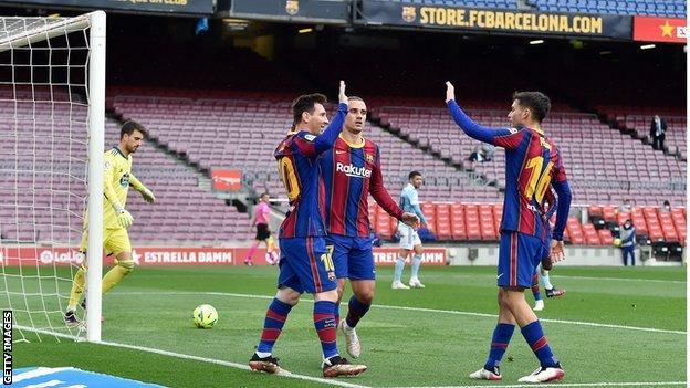 Lionel Messi celebrates with team mates