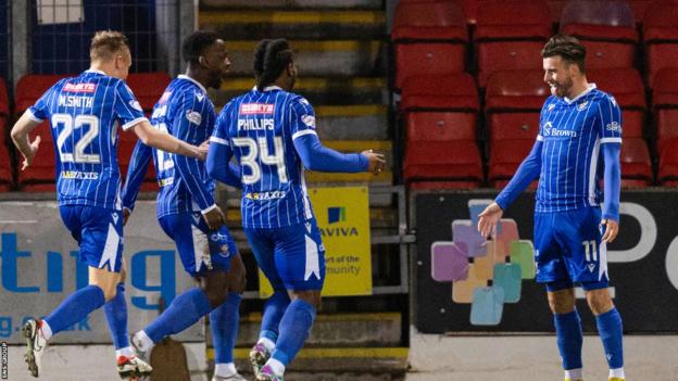 St Johnstone's Graham Carey (R) celebrates scoring with teammates (L-R) Matt Smith, Diallang Jaiyesimi and Daniel Phillips but it's ruled out by VAR for a foul in the build up during a cinch Premiership match between St Johnstone and Aberdeen at McDiarmid Park