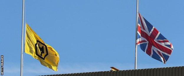 Flags fly at half-mast over the Molineux stands