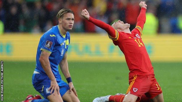 The agony and the ecstasy: Wales' Connor Roberts celebrates as Mykhailo Mudryk of Ukraine looks on