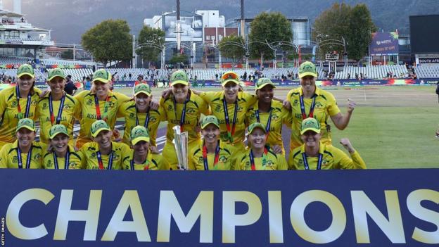 Australia celebrate winning the Women's T20 World Cup trophy after beating South Africa