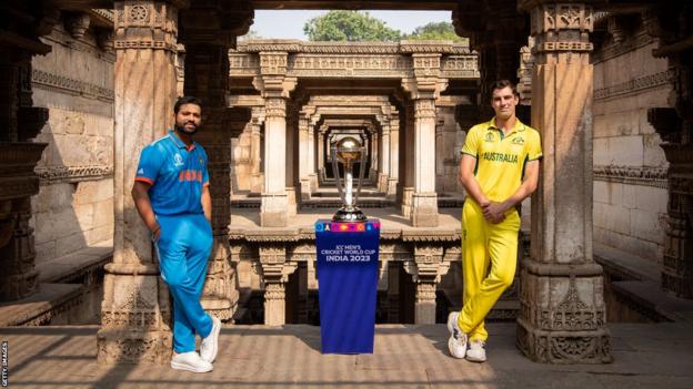 Rohit Sharma and Pat Cummins with World Cup trophy