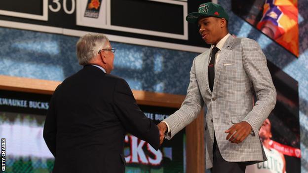 Giannis shakes hands with David Stern