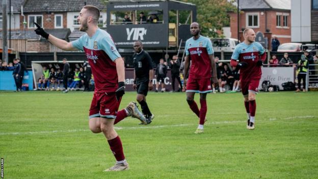 Darryl Sanders celebrates scoring for Farnham Town