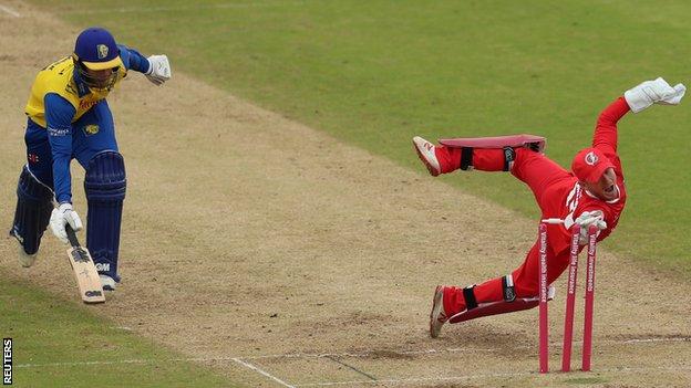 Lancashire's Alex Davies runs out Graham Clark of Durham