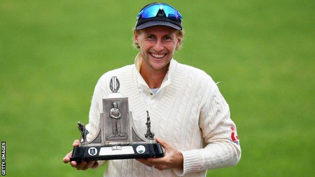 England captain Joe Root smiles as he holds up the Wisden Trophy after beating the West Indies